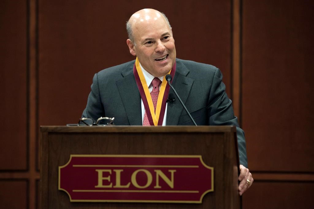 FILE - In this March 1, 2017, file photo, Elon Trustee Louis DeJoy is honored with Elon's Medal for Entrepreneurial Leadership in Elon. N.C.