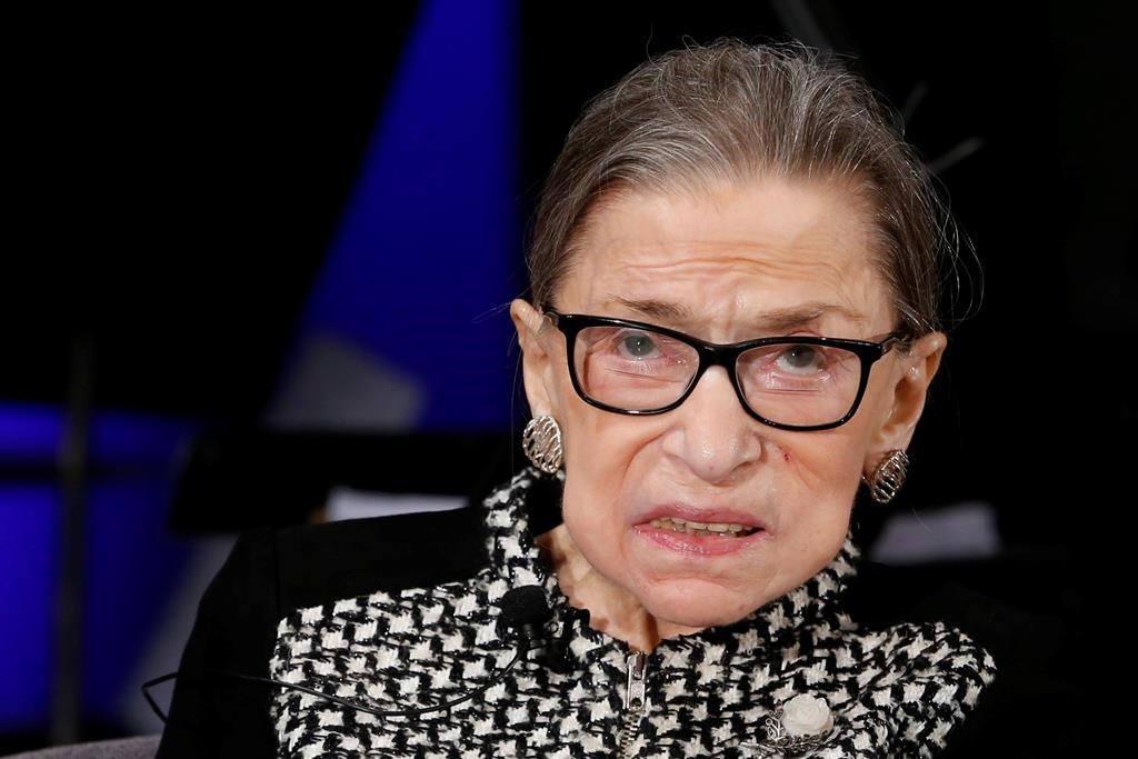 FILE - In this Dec. 17, 2019, file photo, Supreme Court Justice Ruth Bader Ginsburg looks up as she speaks about the antics of her son as she speaks with author Jeffrey Rosen at the National Constitution Center Americas Town Hall at the National Museum of Women in the Arts in Washington.