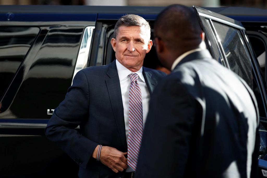 FILE - In this Dec. 18, 2018, file photo, President Donald Trump's former National Security Advisor Michael Flynn arrives at federal court in Washington.