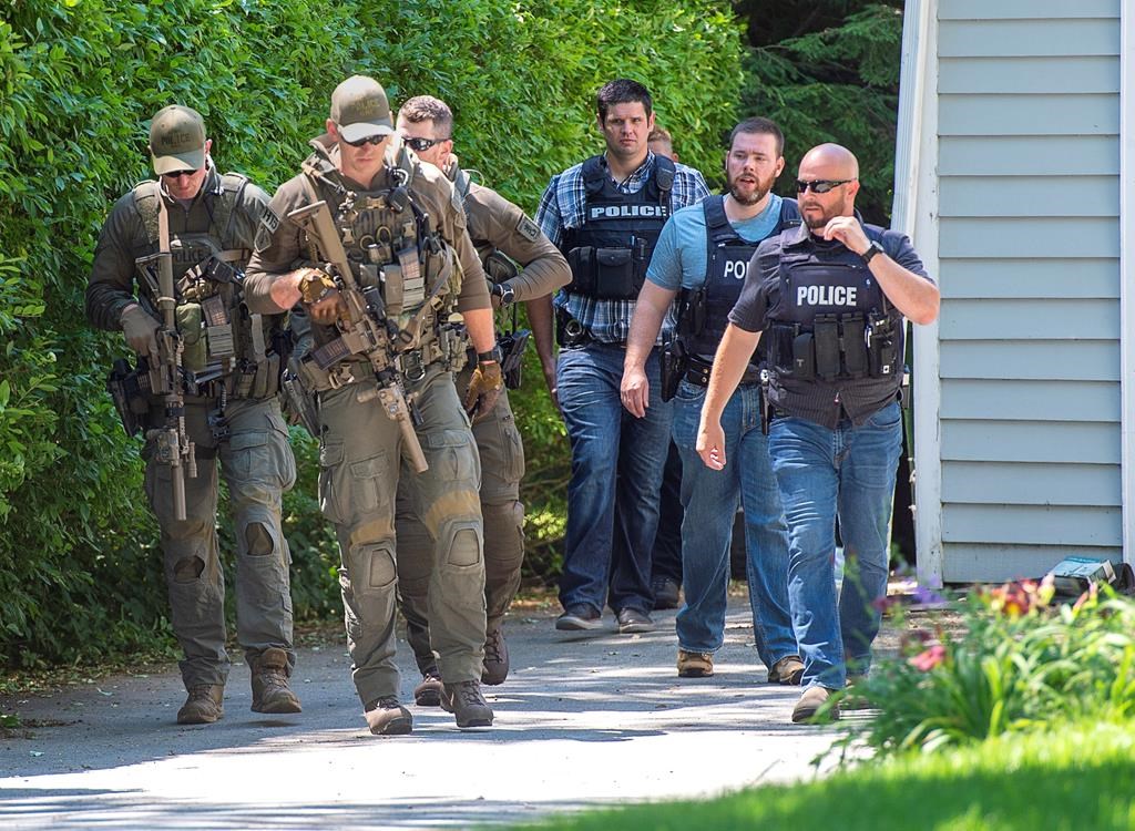 RCMP and town police search for a suspect after a Bridgewater Police Service officer was stabbed as he responded to a domestic violence complaint at The Bridgewater Hotel in Bridgewater, N.S. on Tuesday, July 21, 2020.THE CANADIAN PRESS/Andrew Vaughan