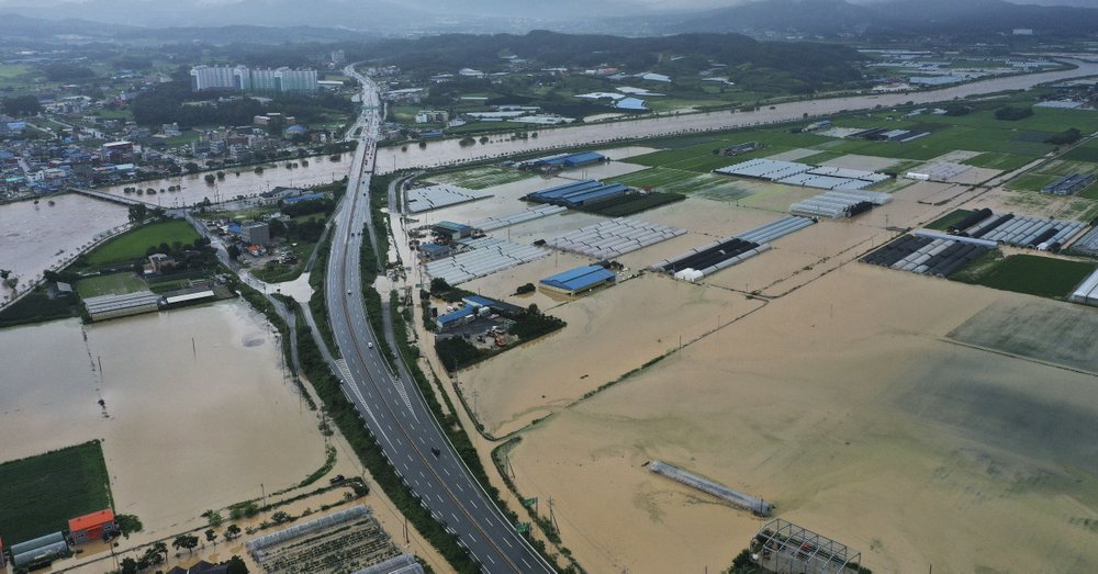 Agricultural lands are inundated with flood waters after heavy rains in Anseong, South Korea, Sunday, Aug. 2, 2020. South Korean Meteorological Administration issued a warning of heavy rain for Seoul and central area.