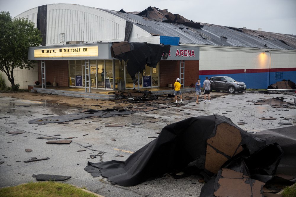 Pieces of the Buccaneer Arena roof litter the parking lot after a strong thunderstorm with high winds blew through the Des Moines metro on Monday, Aug. 10. 2020, in Urbandale, Iowa.