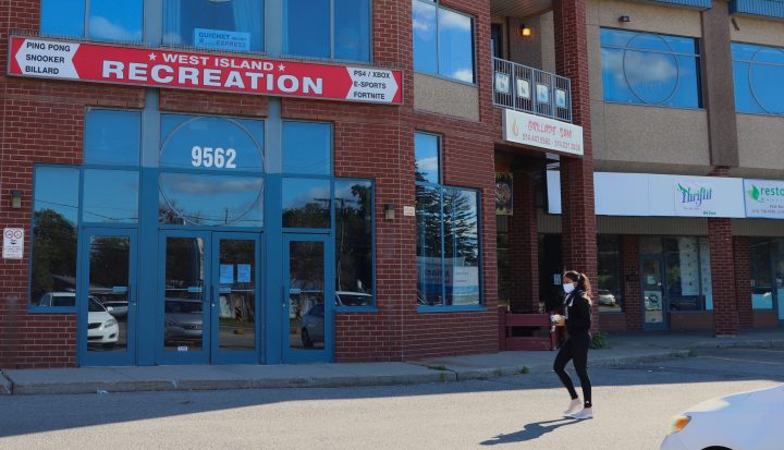 Suyagya Arya, owner of the recreation center, also owns the strip mall where On Rock’s thrift shop will open. Customer of the Pierrefonds strip mall walks passed the future Thriftit on Wednesday, Aug. 19. 2020. Pamela Pagano/Global News