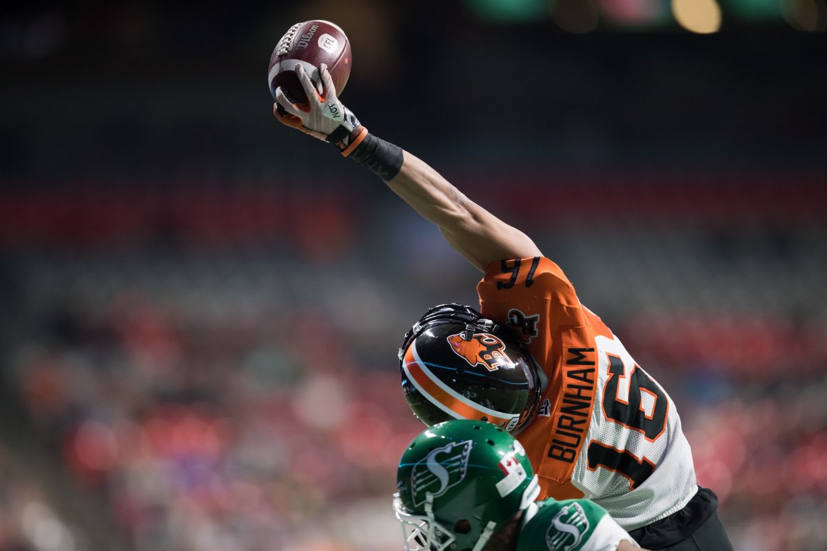 B.C. Lions' Bryan Burnham (16) makes a one-handed catch in the end zone behind Saskatchewan Roughriders' Nick Marshall but is ruled out of bounds during the first half of a CFL football game in Vancouver on Friday October 18, 2019. THE CANADIAN PRESS/Darryl Dyck.