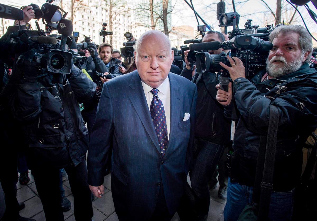 Mike Duffy arrives for his first court appearance at the courthouse in Ottawa in a Tuesday, April 7, 2015, file photo.