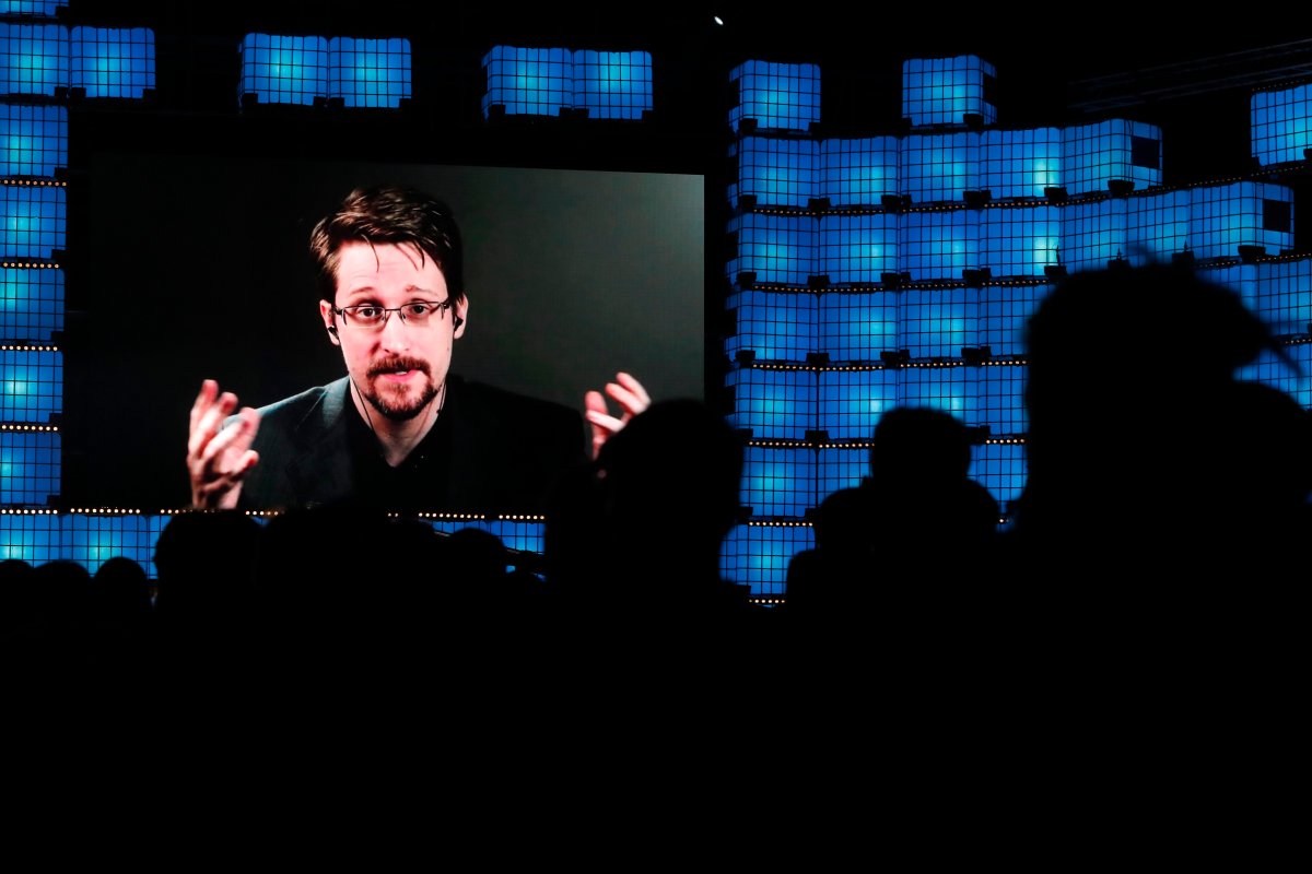 In this Nov. 4, 2019, file photo, former U.S. National Security Agency contractor Edward Snowden addresses attendees through video link at the Web Summit technology conference in Lisbon.