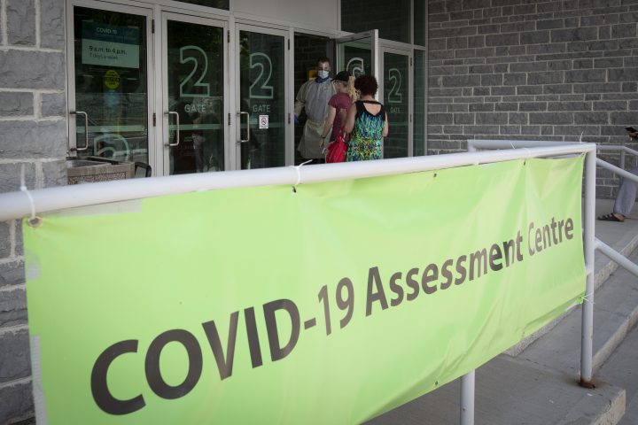 People enter the COVID-19 assessment centre at Leon's Centre in Kingston, Ontario. 