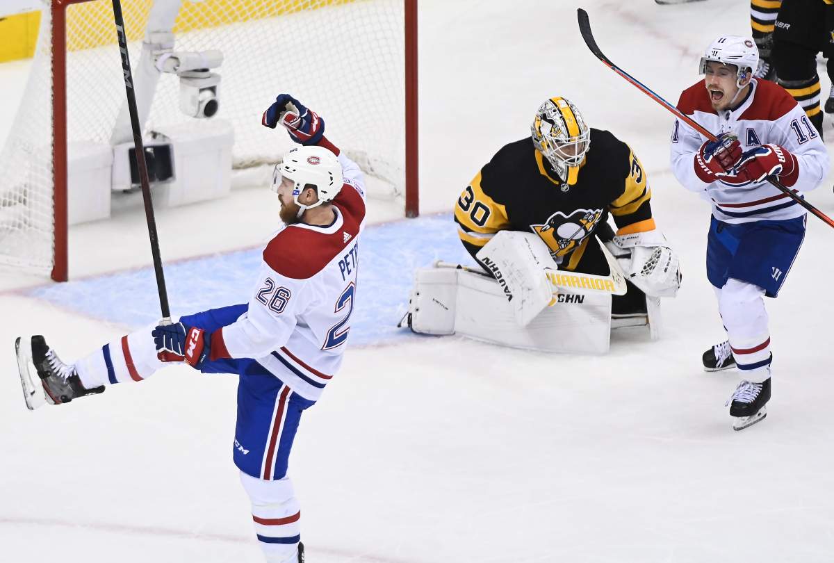 Montreal Canadiens defenceman Jeff Petry (26) celebrates along with Canadiens right wing Brendan Gallagher (11) after scoring the game winning goal past Pittsburgh Penguins goaltender Matt Murray (30) during overtime NHL Eastern Conference Stanley Cup playoff action in Toronto on Saturday, August 1, 2020. 