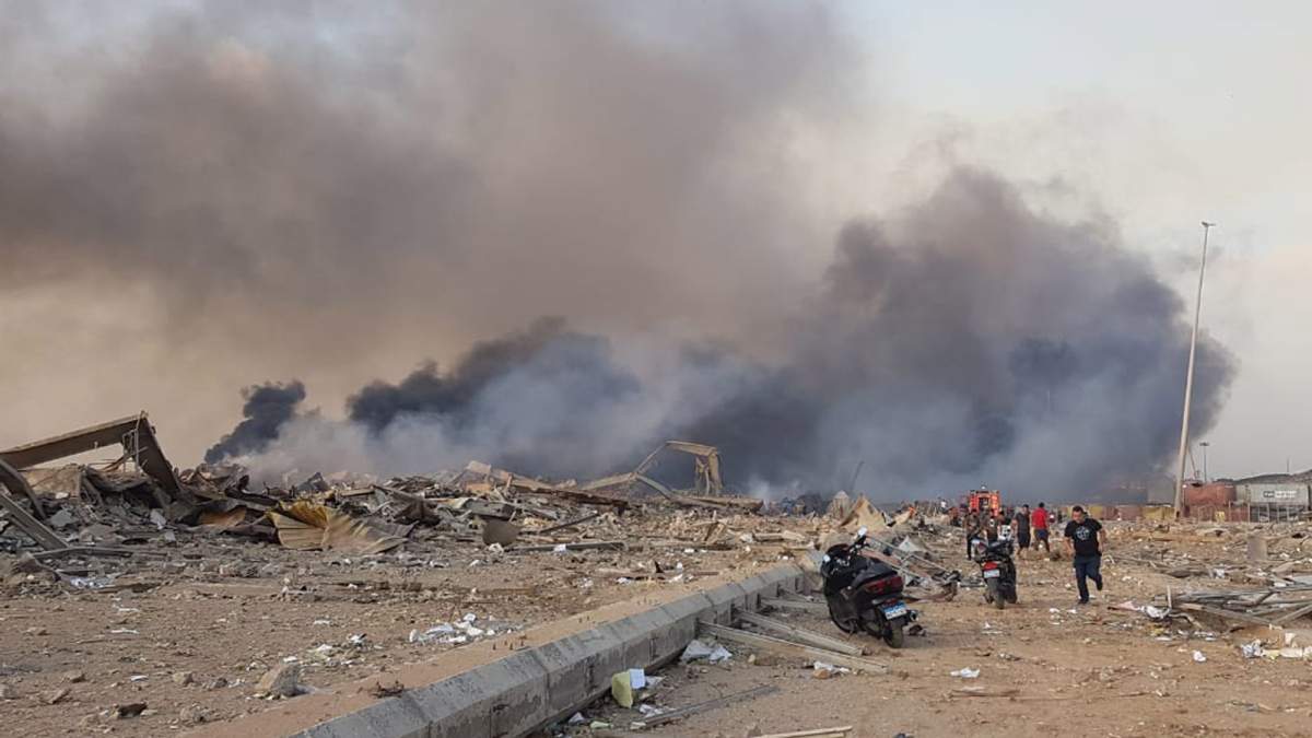 Smoke columns rise from the site of an explosion at the Beirut Port, Beirut, Lebanon, Aug. 4, 2020.
