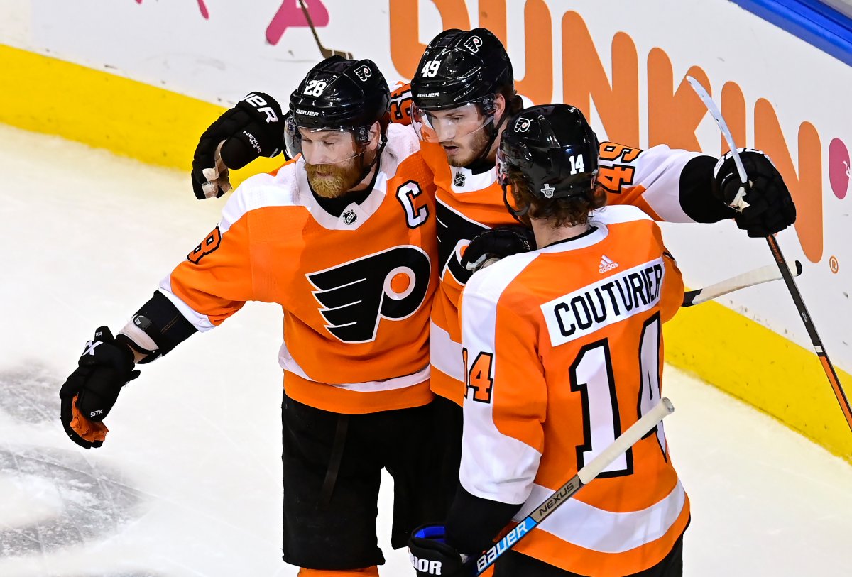 Philadelphia Flyers' Joel Farabee (49) celebrates his goal against the Montreal Canadiens with teammates Claude Giroux (28) and Sean Couturier (14) during second period NHL Eastern Conference Stanley Cup first round playoff action in Toronto on Wednesday, August 12, 2020.