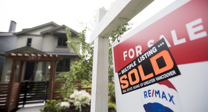 FILE - A real estate sign is pictured in Vancouver, B.C., Tuesday, June, 12, 2018. The Canadian Real Estate Association says home sales in July hit a record high as they continued their rebound from the lows of earlier this year when the COVID-19 froze the market. THE CANADIAN PRESS Jonathan Hayward.