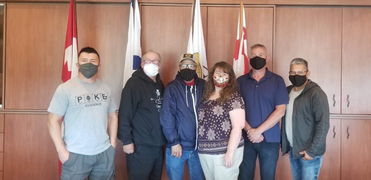 Eskasoni Chief Leroy Denny, left to right, Membertou Chief Terry Paul, We'koqma'q Chief Rod Googoo, Union of Nova Scotia Mi’kmaq emergency management coordinator Jennifer Jesty, Wagmatcook Chief Norman Bernard and Potlotek Chief Wilbert Marshall pose for a photo in Membertou, N.S., on Thursday, Aug. 27, 2020 in this handout photo. The five Mi’kmaq chiefs met to learn how to use the community-specific alert system that is set to launch next week. 