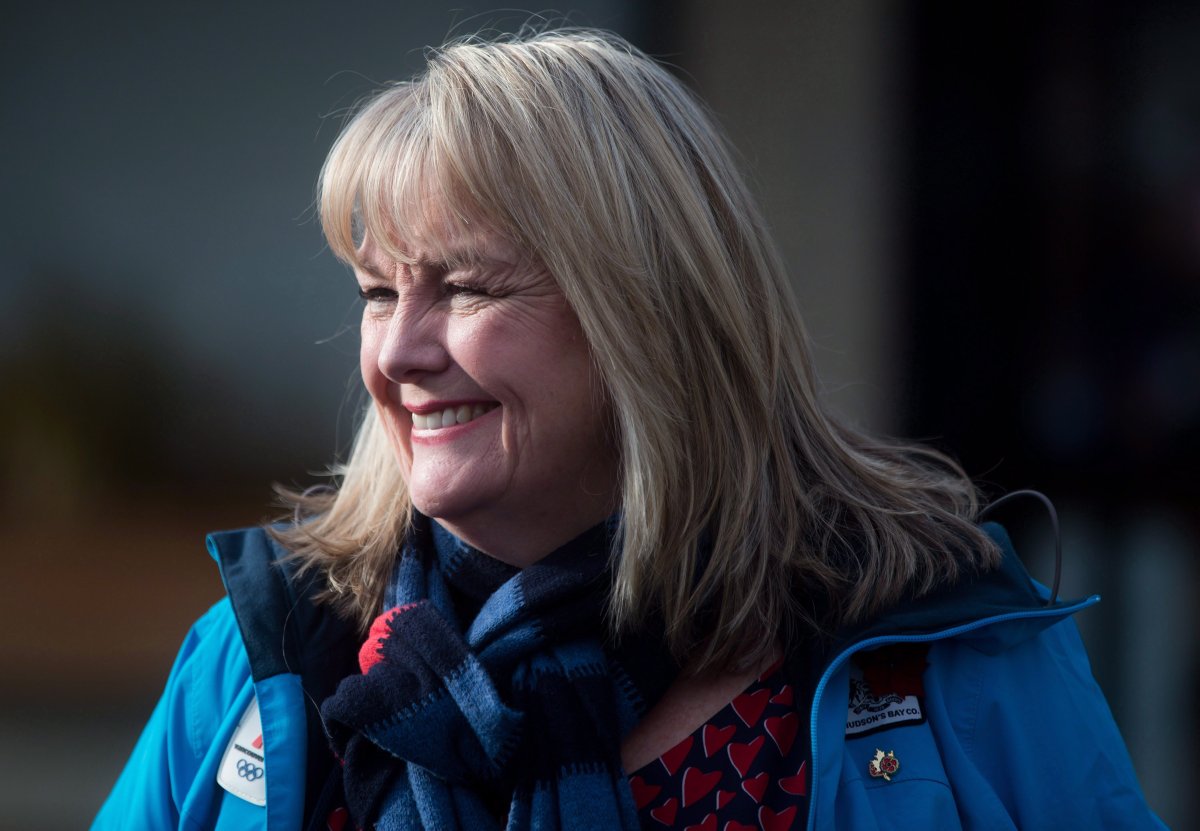  Kerry-Lynne Findlay smiles while campaigning with then-Conservative Leader Andrew Scheer, not shown, in Surrey, B.C., Monday, Dec. 4, 2017.
