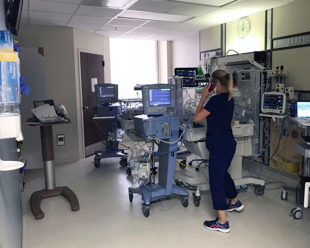A medical staffer helps take care of babies who were at the hospital during Hurricane Laura on Thursday Aug. 27, 2020 in Lake Charles, La.