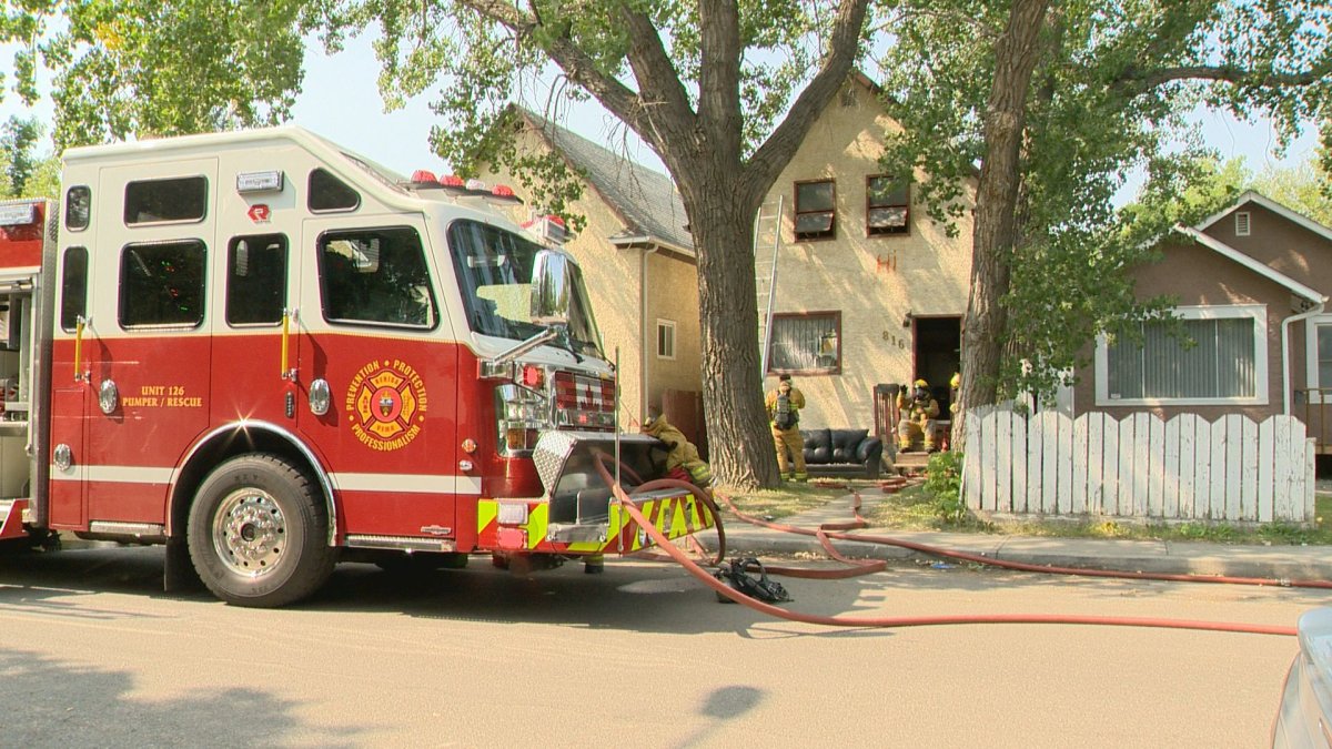 Regina firefighters respond to a residential fire on Cameron Street, Saturday.
