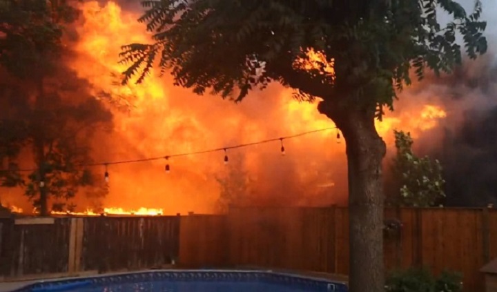 A screenshot of a video that appears to show a large residential fire in Kitchener Monday evening.
