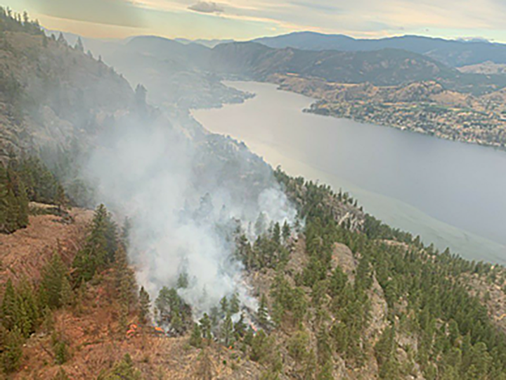 BC Wildfire says the Christie Mountain wildfire moved past a retardant line along the eastern flank, moving from an inaccessible area into a ravine.