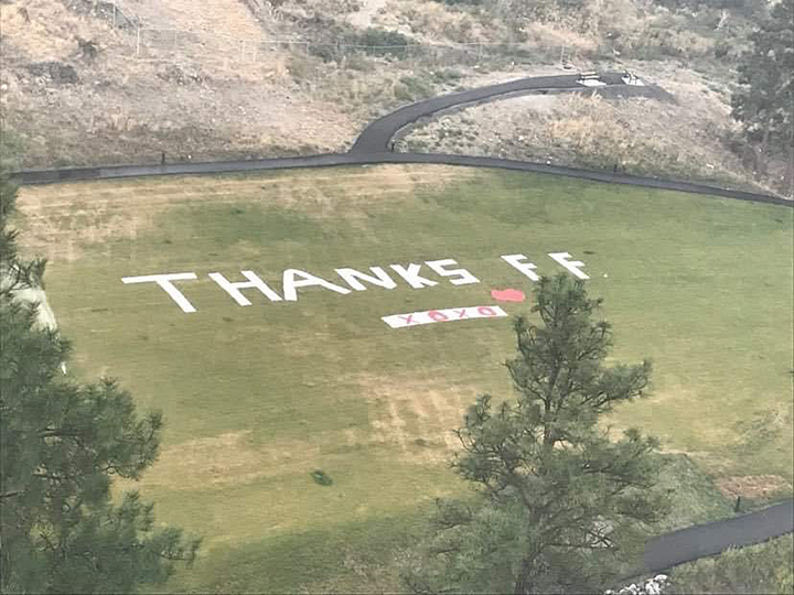 An aerial photo of the massive thank you message that a group of Heritage Hills residents created for firefighters battling the Christie Mountain wildfire.