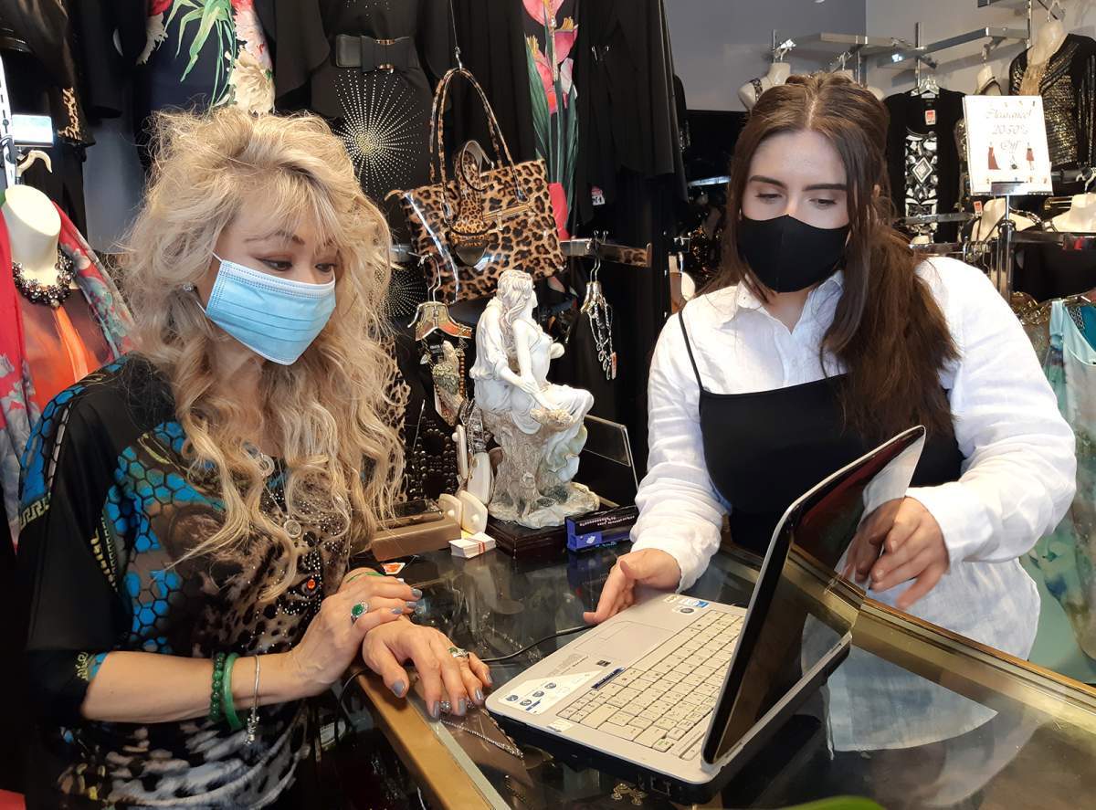 Lien Vu, left, owner of T-Elle Boutique on Charlotte Street in Peterborough, works with Digital Service Squad member Yllka Bojku on her Digital Transformation Plan.