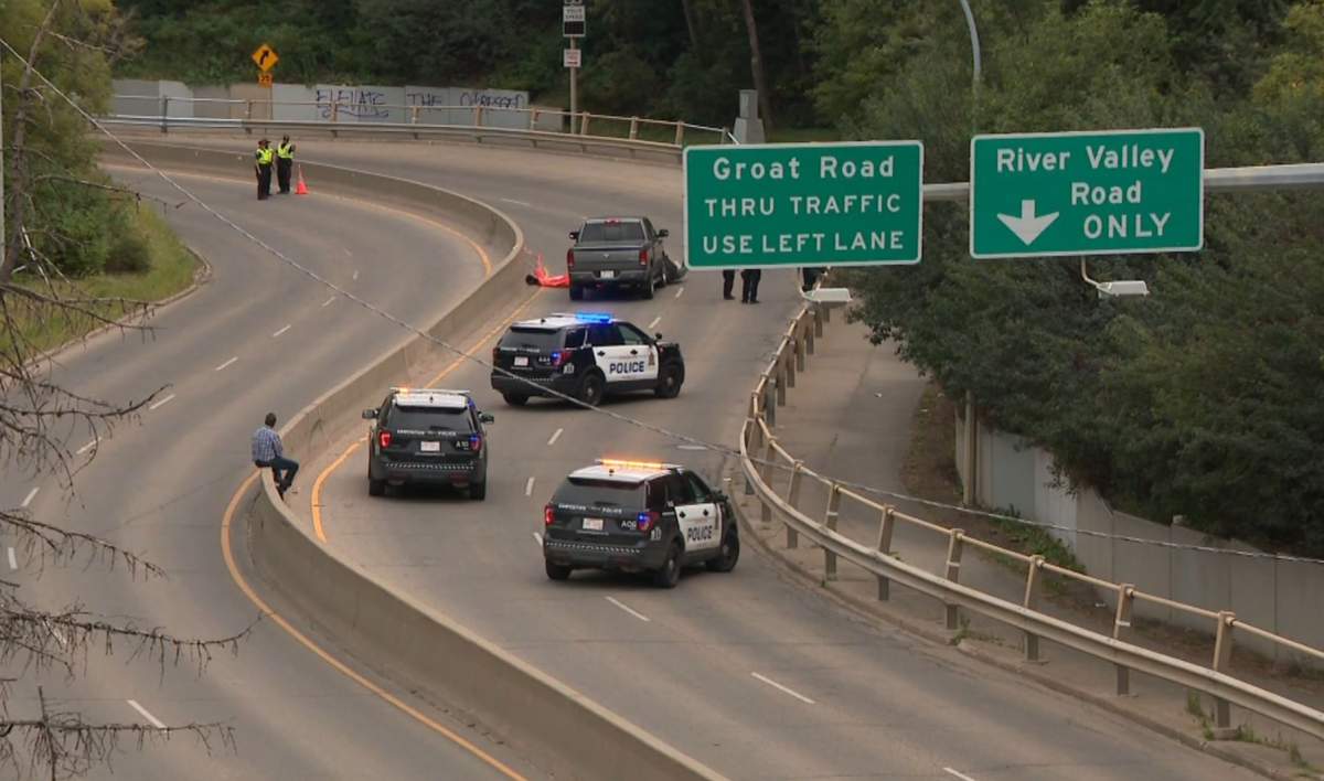 Edmonton police investigating a collision between a pickup truck and a motorcycle on Groat Road on Monday, Aug. 31, 2020. 
