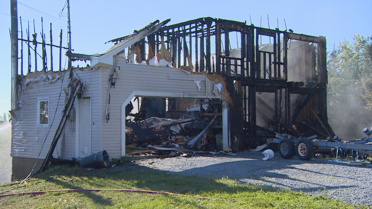 A family safely evacuated their home in Herring Cove, N.S., as it was engulfed in flames Friday morning. 