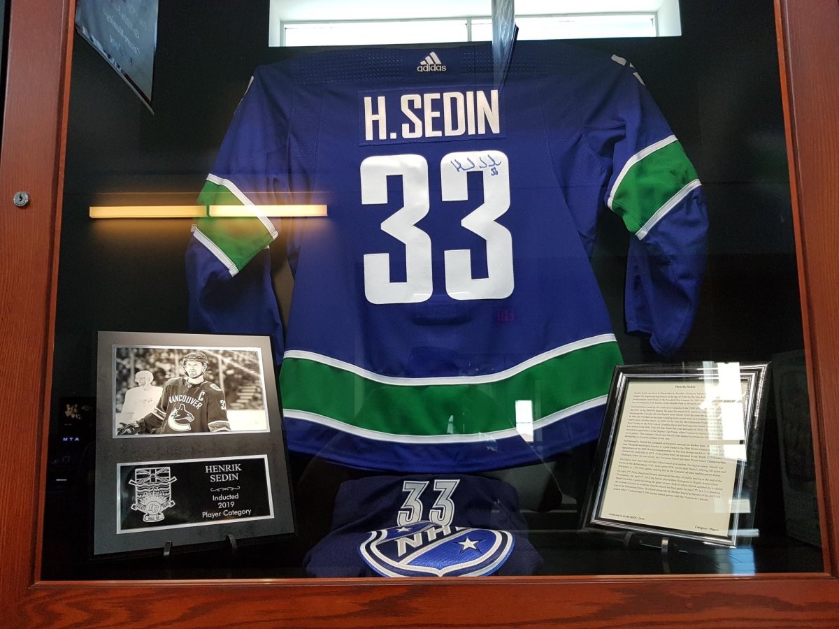 Two Vancouver Cannucks Hockey Jerseys Autographed by The Sedin