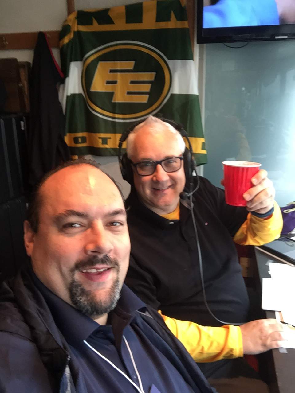 Dave Campbell and Morley Scott call an Edmonton football game from their booth in Commonwealth Stadium.