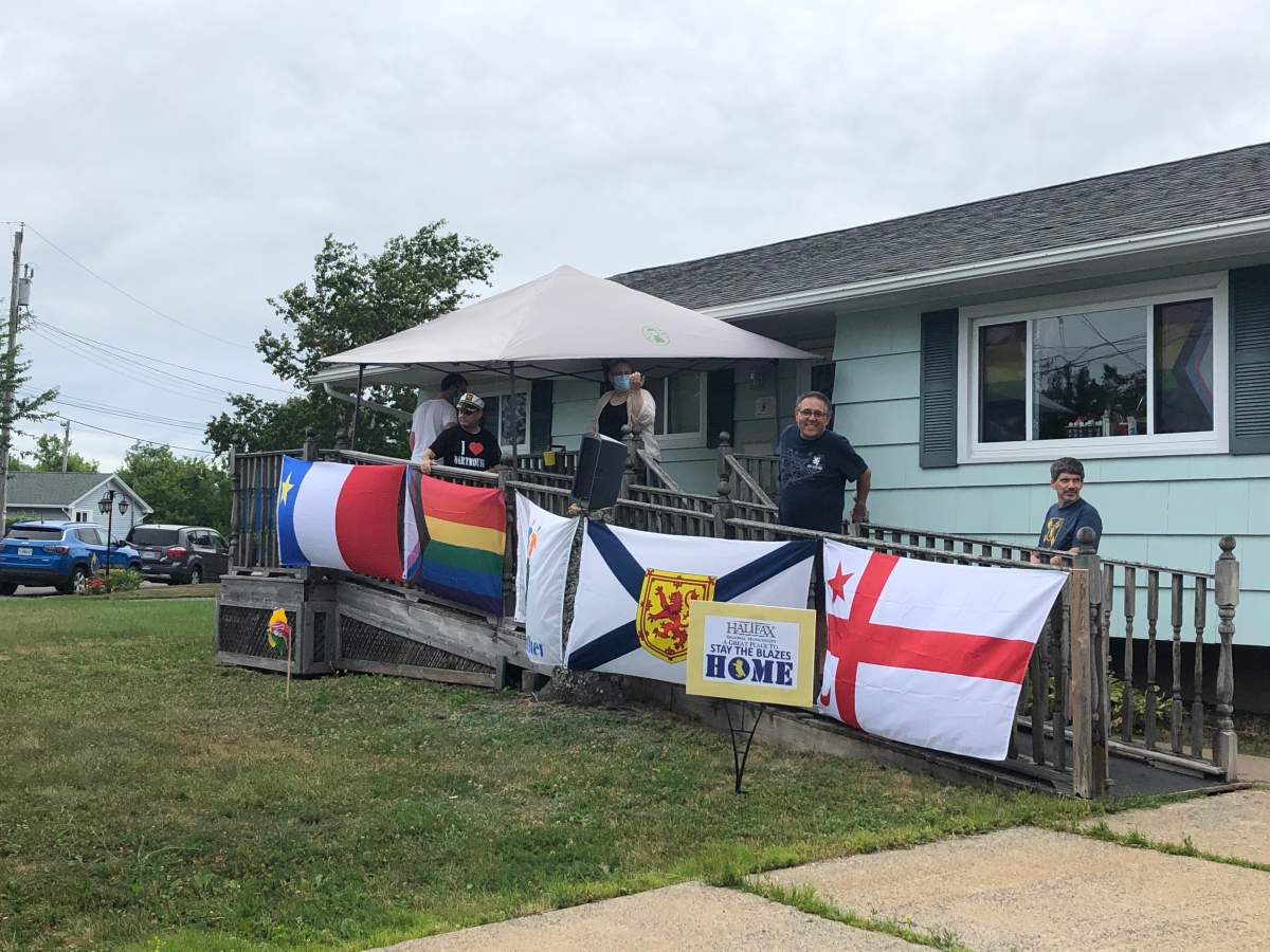 The residents of the Hilton Drive Group Home in Dartmouth celebrate Natal Day with a 'Reverse Parade' featuring a stationary float on their front lawn, Aug. 3, 2020. 