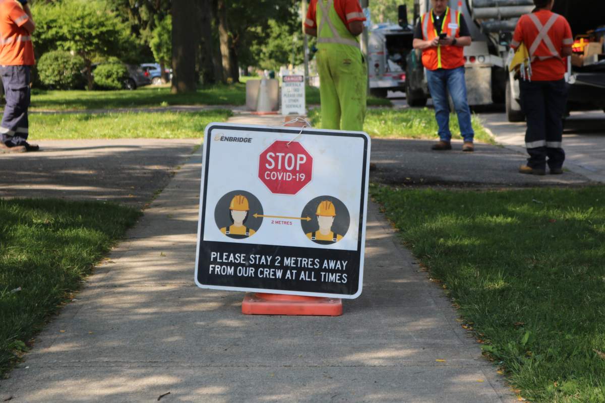 Crews on Grey Street after a car struck a house and severed a gas line. 