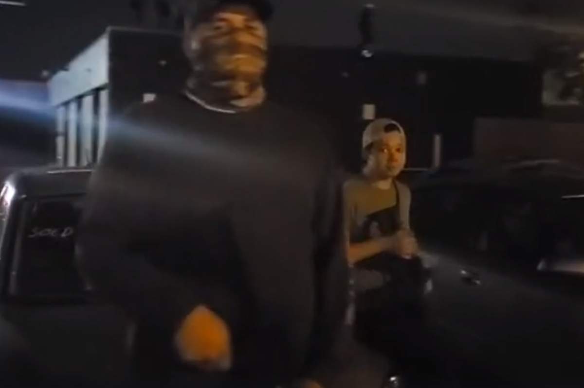 This still image from video shows a young man who identified himself as ‘Kyle,’ right, outside a gas station with militia late Tuesday, Aug. 25, 2020, in Kenosha, Wis.