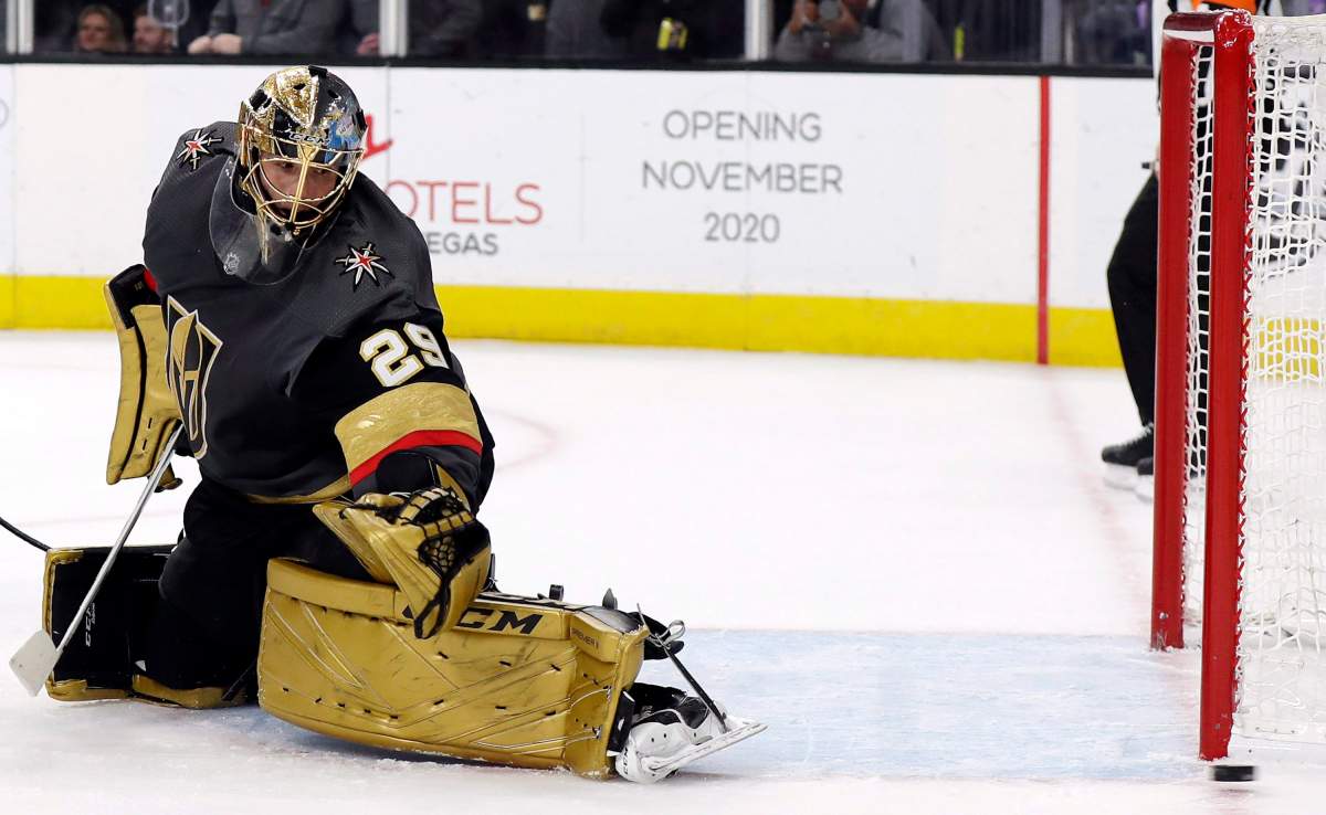 A shot flies wide past Vegas Golden Knights goalie Marc-Andre Fleury during the first period of the team's NHL hockey game against the New York Islanders on Saturday, Feb. 15, 2020, in Las Vegas.