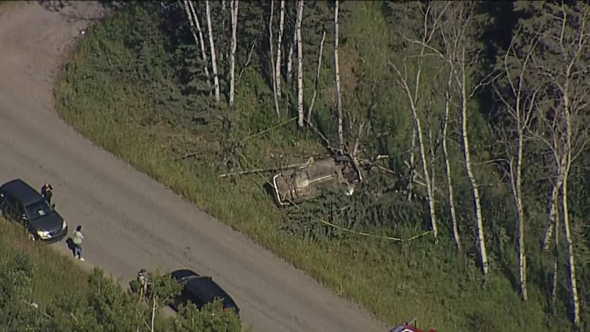 First responders at the scene of a crash near Priddis, Alta., on Aug. 25, 2020.