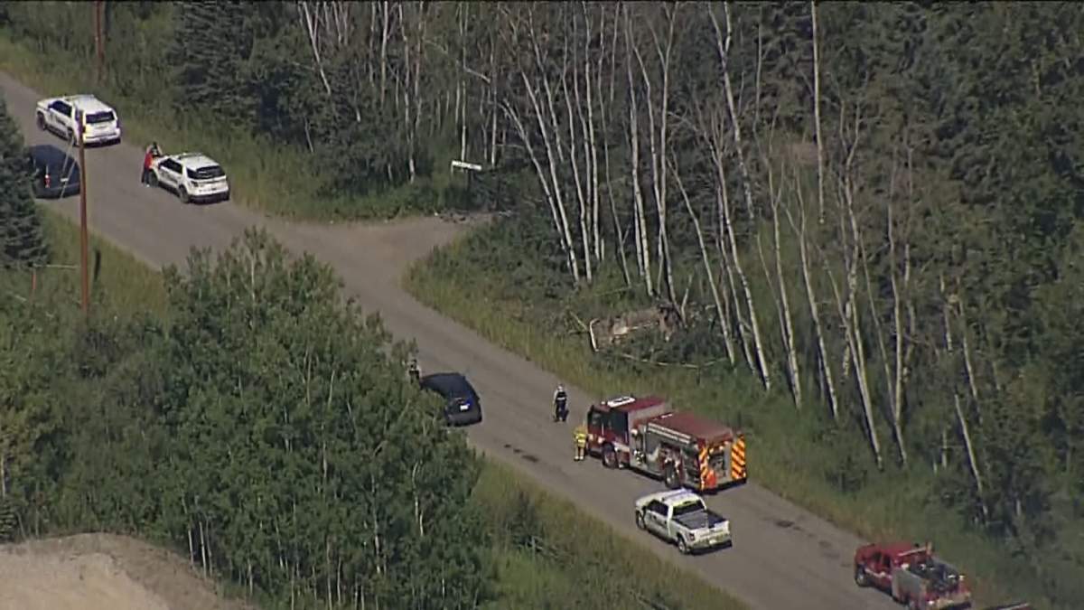 First responders at the scene of a crash near Priddis, Alta. 