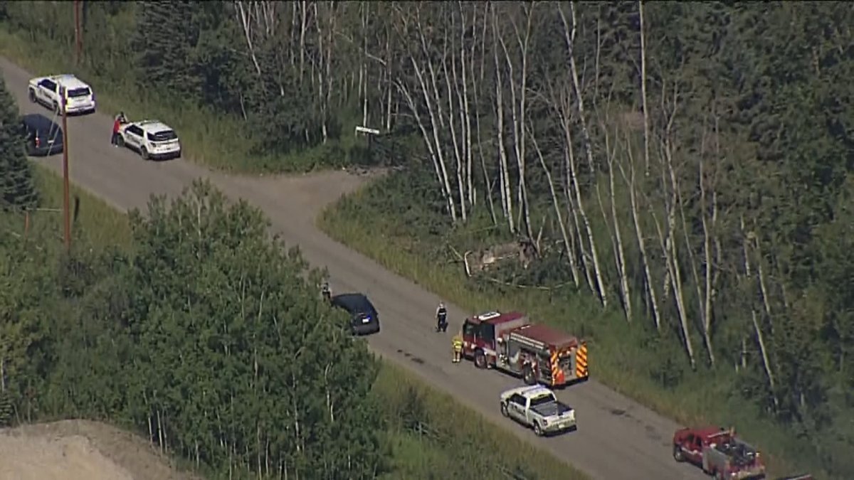 First responders at the scene of a crash near Priddis, Alta. 