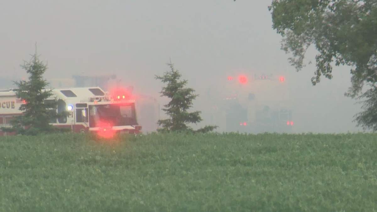 Heavy equipment and 32 firefighters were deployed to a blaze at a barn in Sturgeon County late Monday afternoon.
