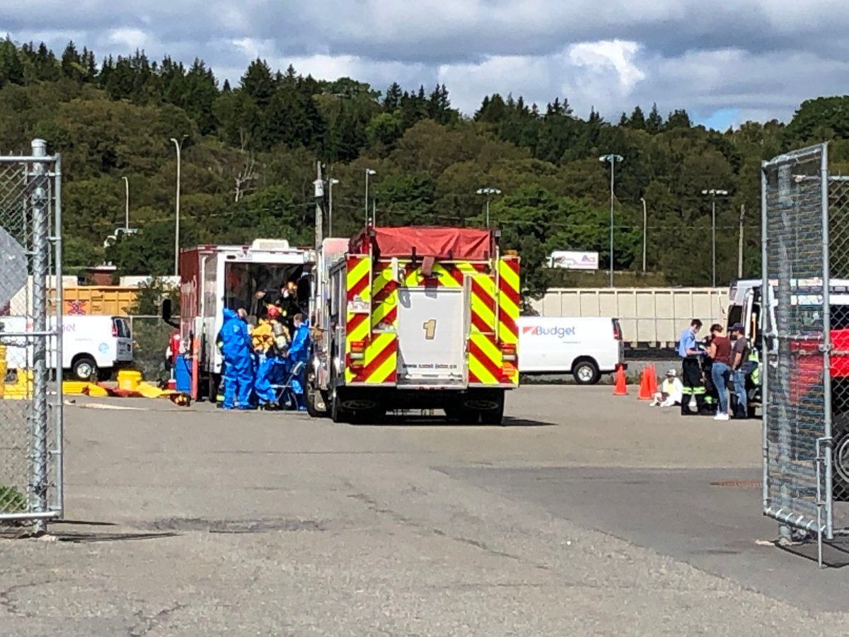A hazmat unit suits up at the Canada Post facility in Saint John, N.B., on August 31, 2020. They were investigating the discovery of an unknown white powder.
