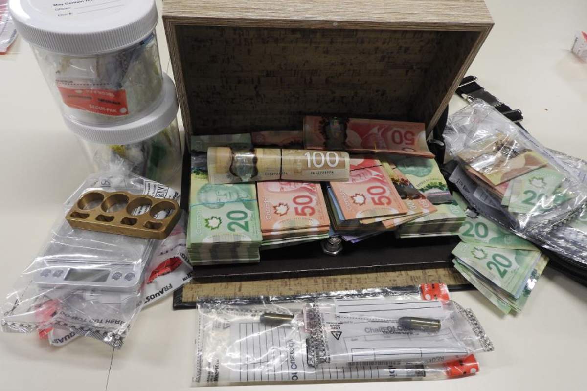 Waterloo Regional Police say drugs, cash and weapons were seized as part of the investigation.