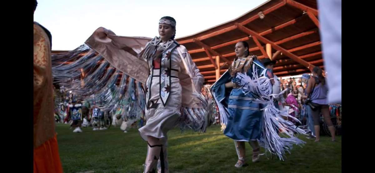 A photo of Chantelle Willier (left), who is hoping the public will help her find powwow regalia that was stolen from her. In this photo, she is wearing a different regalia outfit.