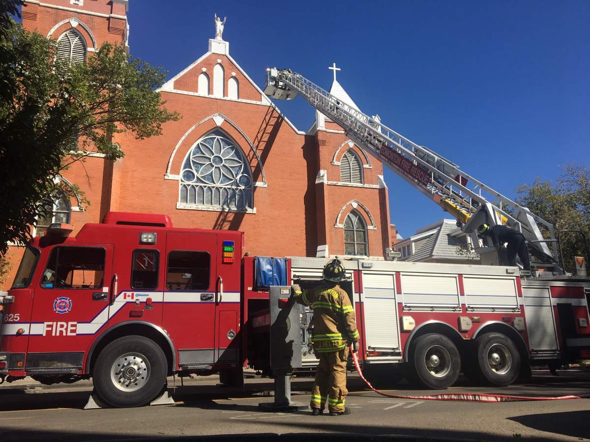 Fire crews on scene at the Sacred Heart Catholic Church on Sunday, Aug. 30, 2020.