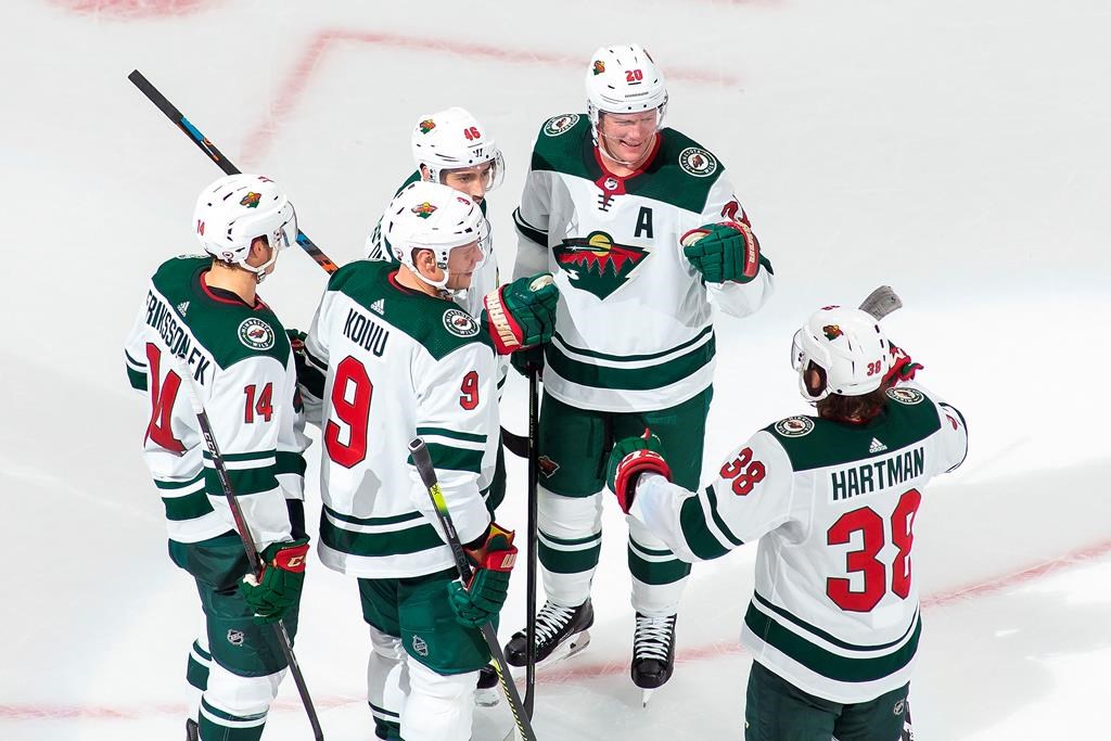 Minnesota Wild’s Joel Eriksson Ek (14), Mikko Koivu (9), Jared Spurgeon (46), Ryan Suter (20) and Ryan Hartman (38) celebrate a goal during third-period NHL Stanley Cup qualifying-round action against the Vancouver Canucks in Edmonton, Sunday, Aug. 2, 2020. THE CANADIAN PRESS/Codie McLachlan
