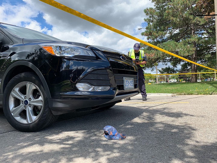 Police investigating the scene at The East Mall and Burnhamthorpe Road in Etobicoke.