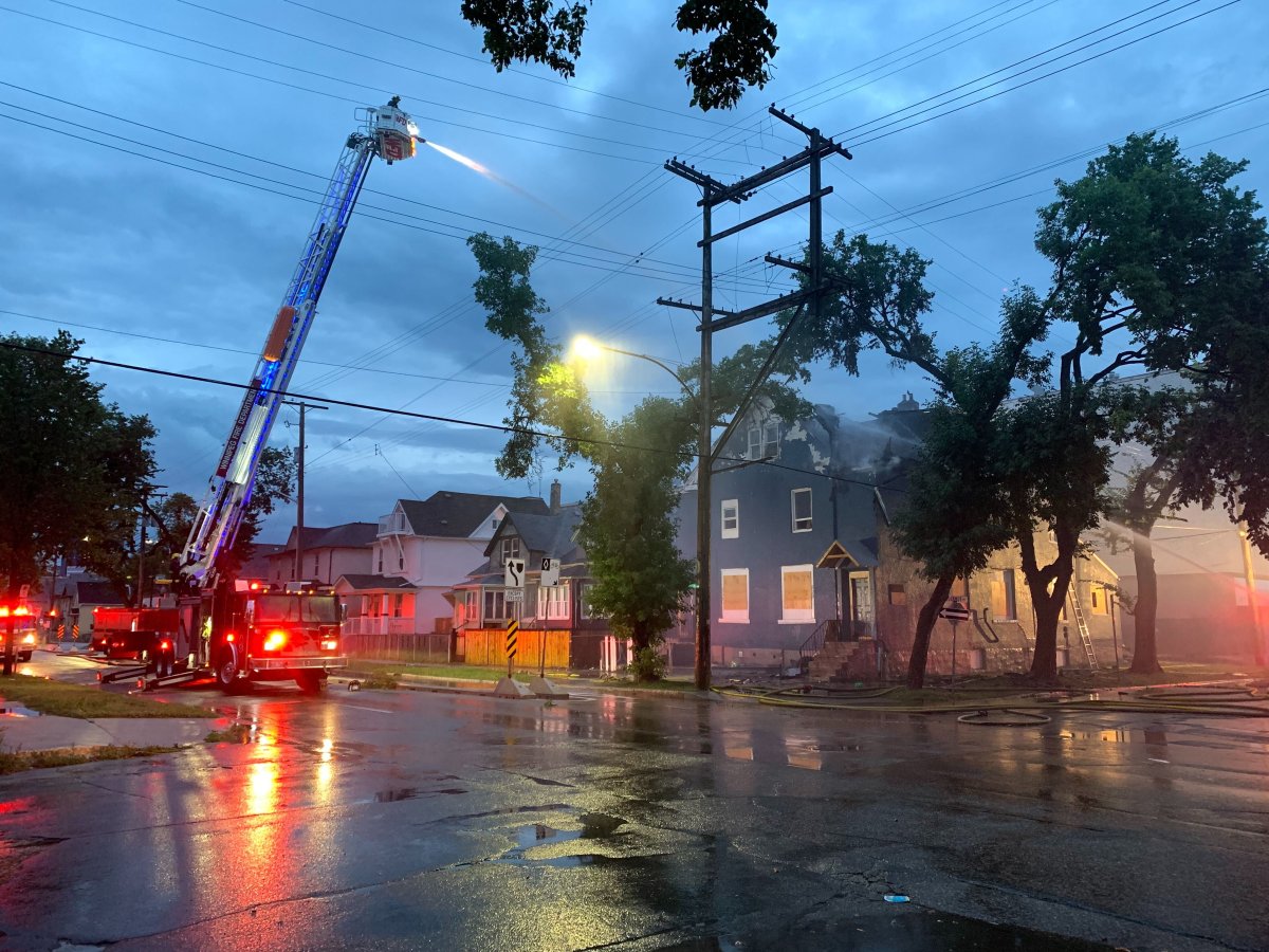 Fire crews battle a blaze on McDermot Avenue in Winnipeg.