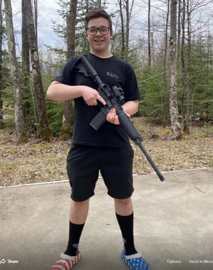 Kyle Rittenhouse is shown with an AR-15-style rifle in this image from his Facebook page on May 4, 2020.