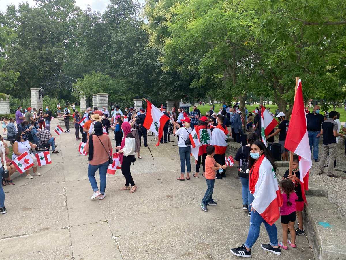 A rally in support of Lebanon drew 150 to 200 people to Victoria Park, many of them waving a Lebanese or Canadian flag.