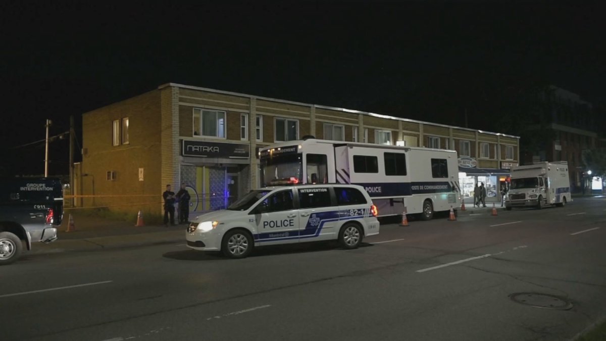 A police command post was parked outside the apartment building on Henri-Bourassa Boulevard East on Friday.