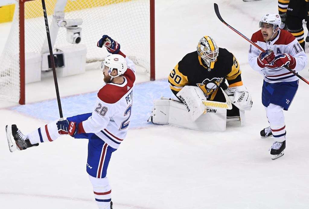 In this file photo, Montreal Canadiens defenceman Jeff Petry (26) celebrates along with Canadiens right wing Brendan Gallagher (11) after scoring the game winning goal past Pittsburgh Penguins goaltender Matt Murray (30) during overtime NHL Eastern Conference Stanley Cup playoff action in Toronto on Saturday, August 1, 2020.