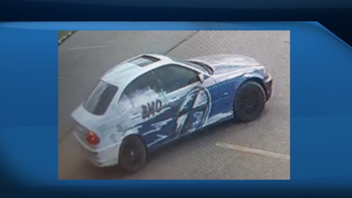 Police need help finding a person of interest's vehicle, a silver four-door BMW 335I with distinct blue markings on the right side and British Columbia licence plate 719 RCF.