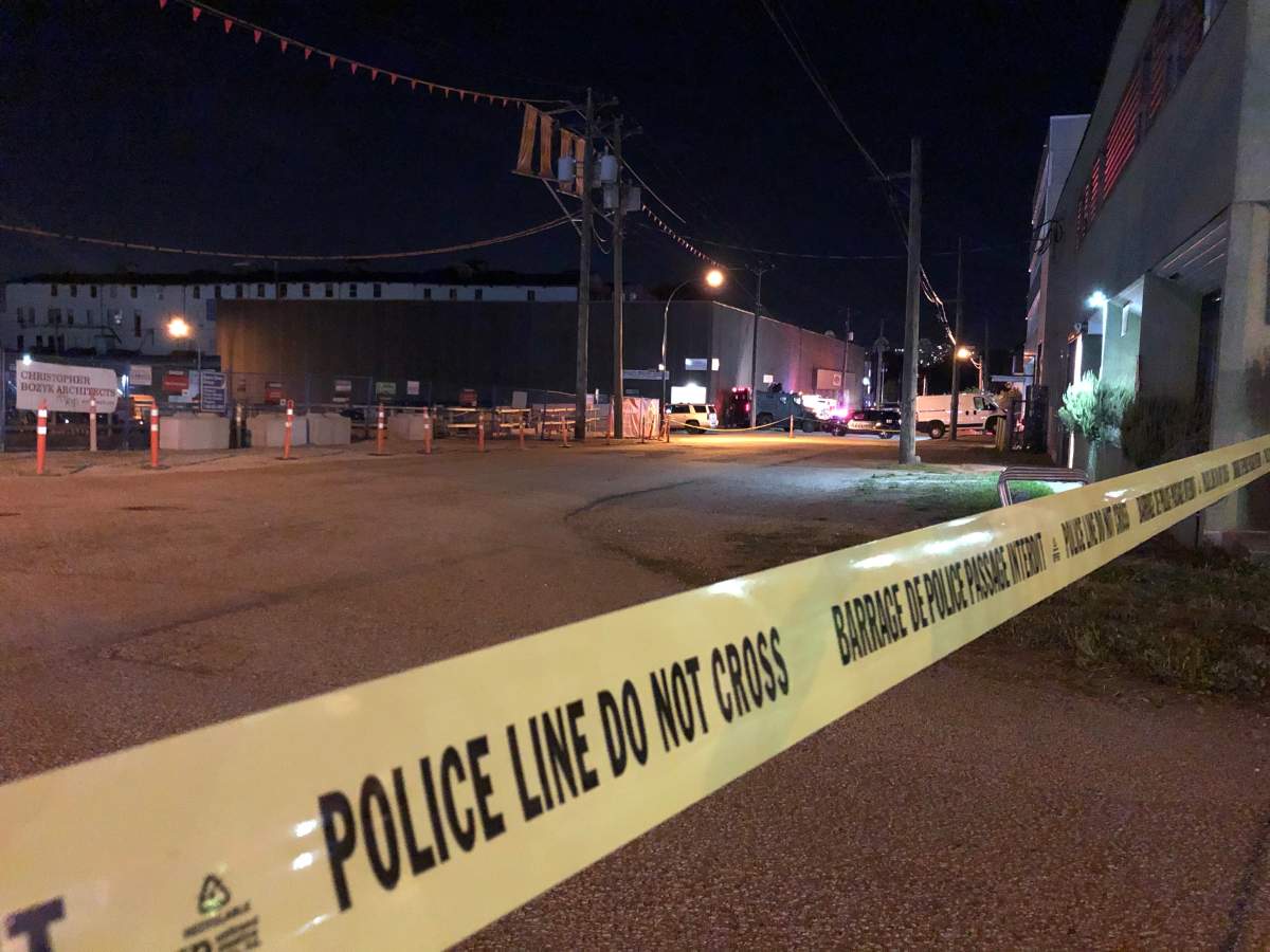 Yellow police tape cordons off an area near Parker Street in East Vancouver where police negotiators attempted to coax an allegedly armed individual into giving himself up peacefully on Wednesday night.