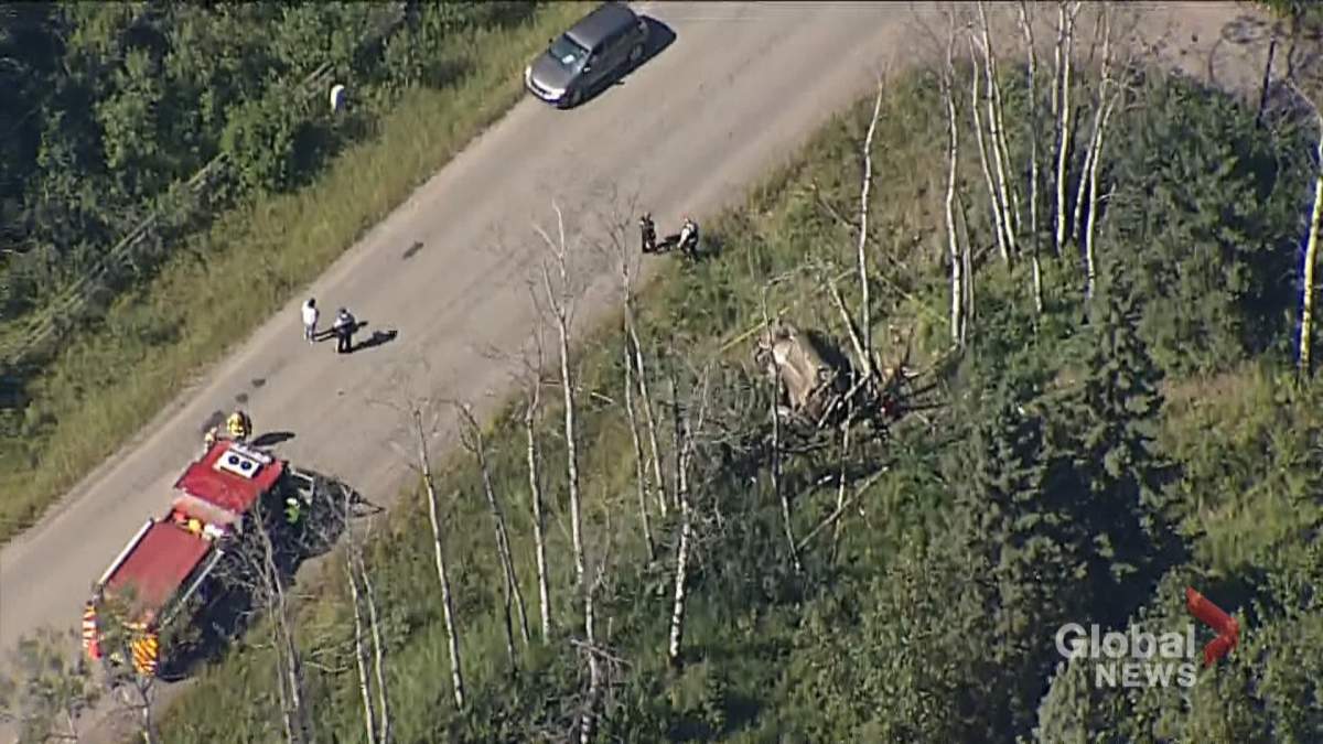 First responders at the scene of a crash near Priddis, Alta.