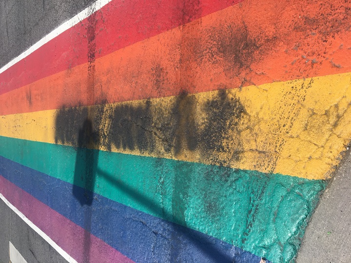 A photo of the vandalized, damaged Pride rainbow crosswalk in Aurora.